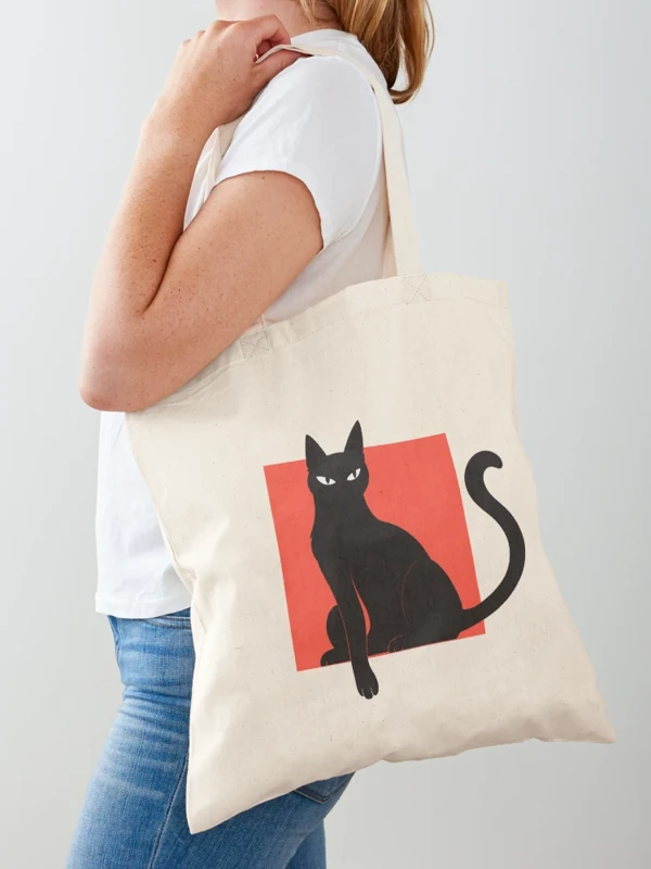 Chat noir qui sort du cadre sur Tote bag classique