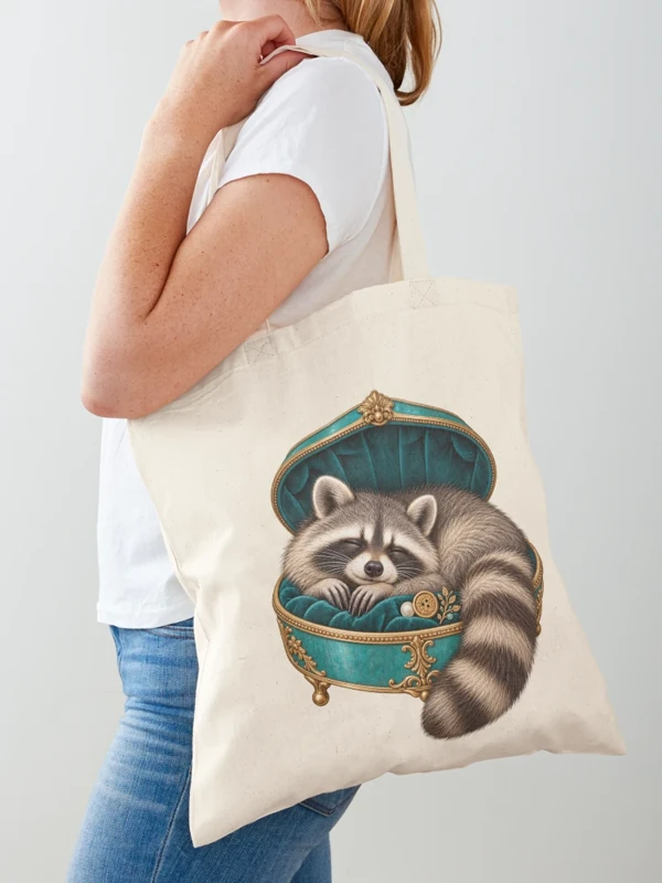 Raton laveur endormi dans un écrin précieux sur Tote bag classique