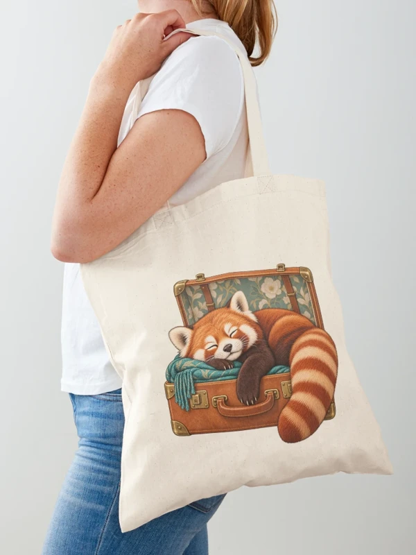 Panda roux endormi dans une valise sur Tote bag classique