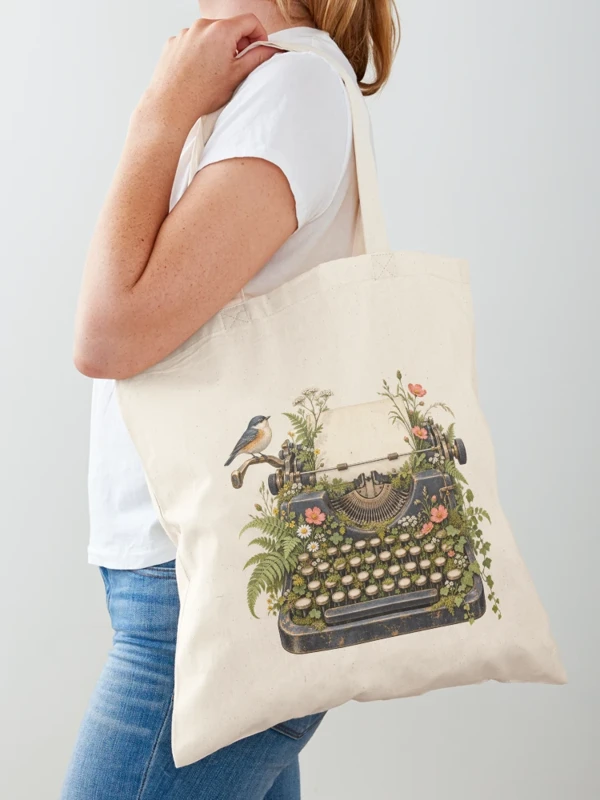 Machine à écrire envahie de fleurs sauvages sur Tote bag classique